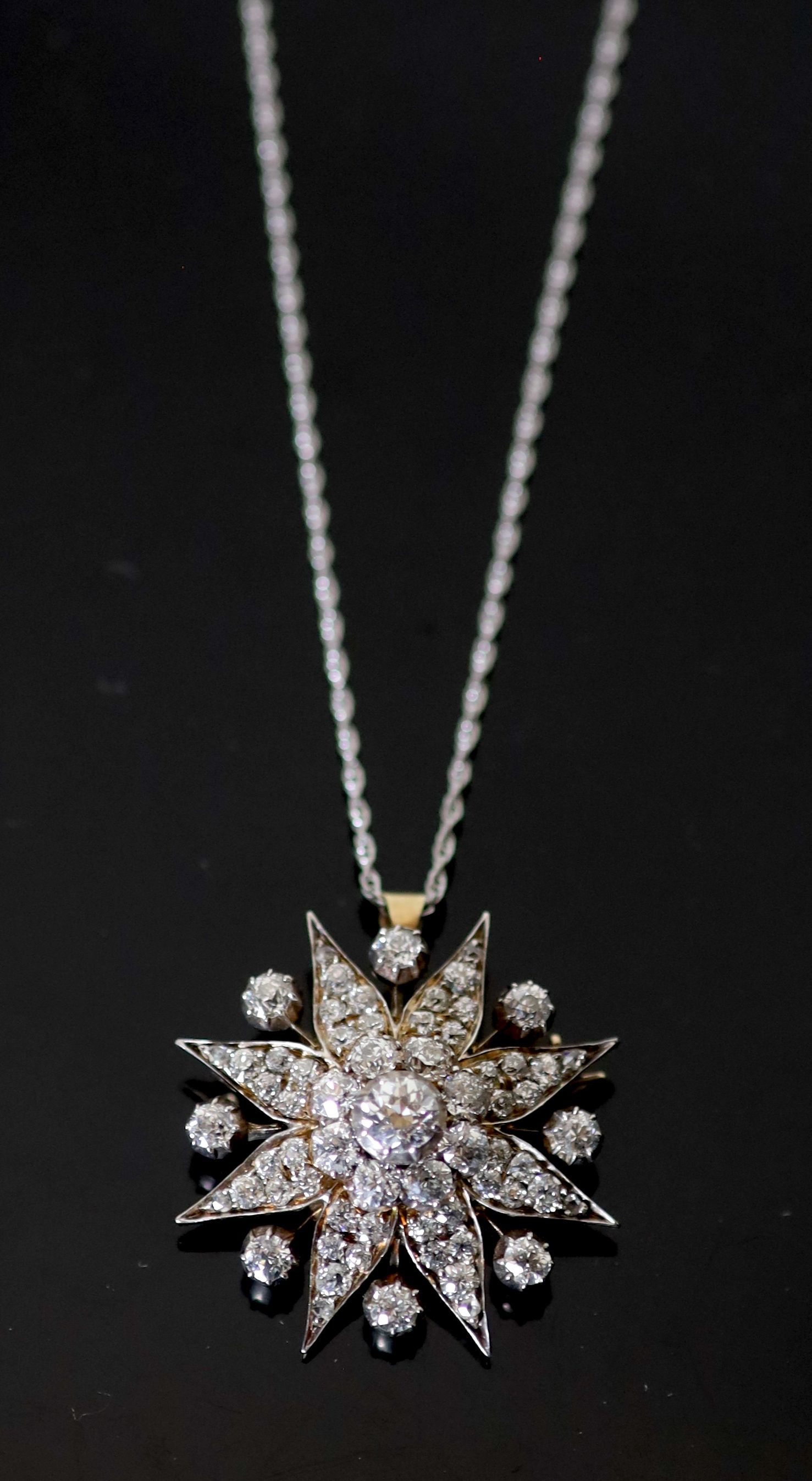 A Victorian, gold, silver and diamond cluster set star pendant brooch,